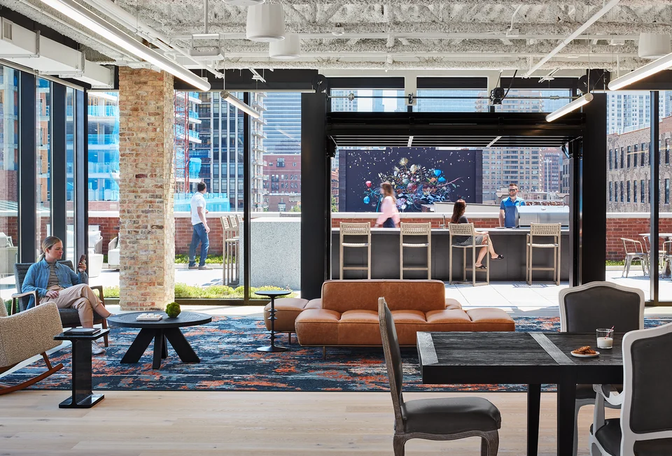 Bright lounge with large windows and people at Mondelez International headquarters in Chicago